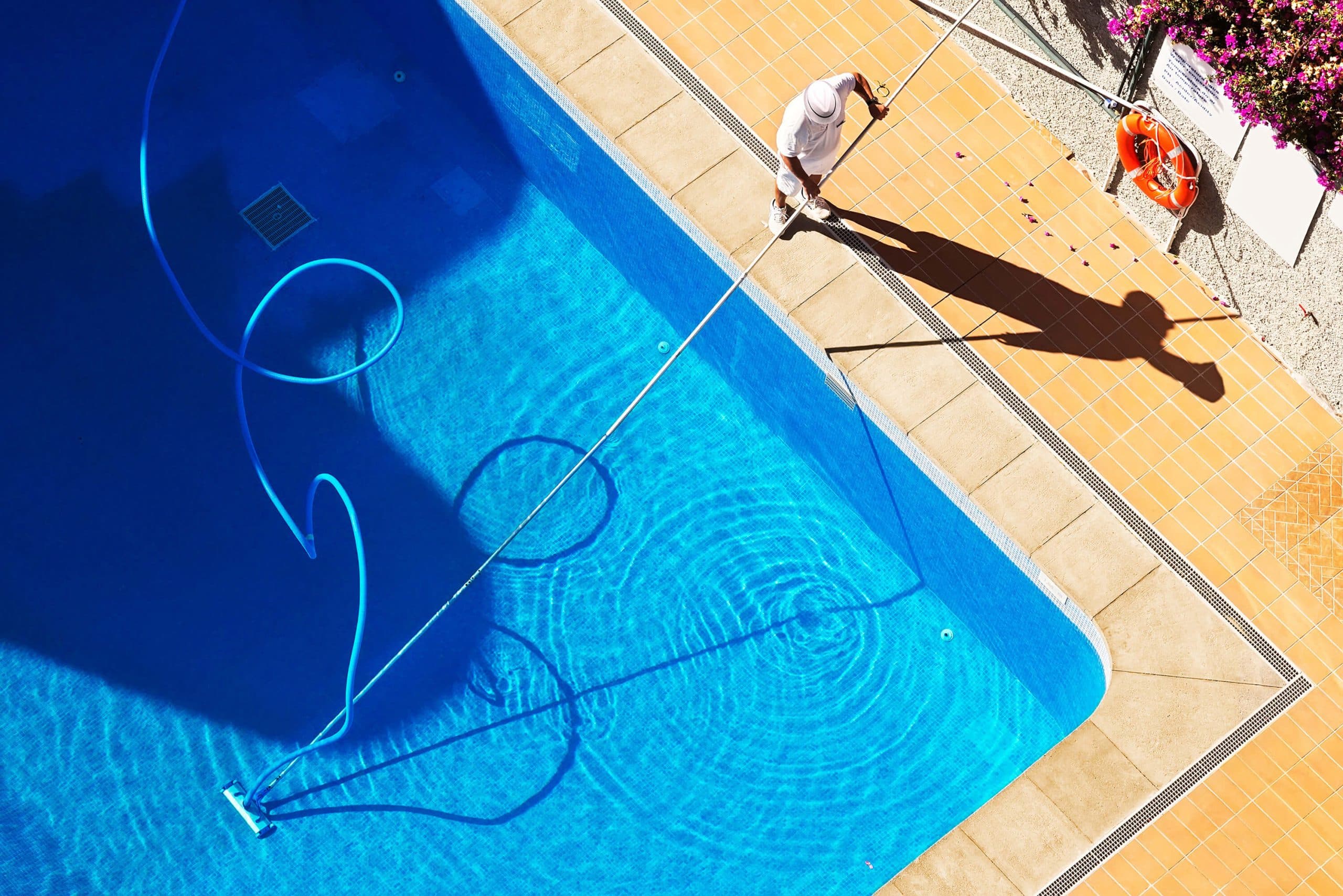 Aerial view of a crystal clear pool maintained by Clear Conceptz